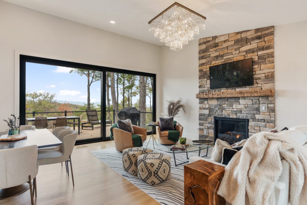 Spacious living room with open floor plan at Wander Cedar Mountain, featuring stylish furnishings and mountain views