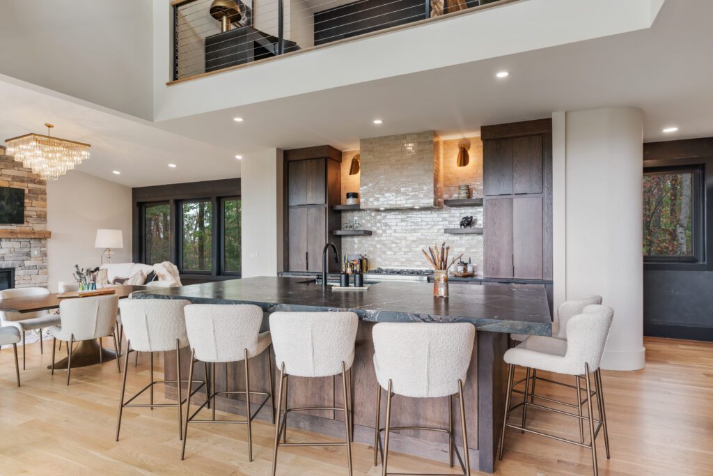 Modern kitchen at Wander Cedar Mountain featuring stylish bar stools and a spacious island