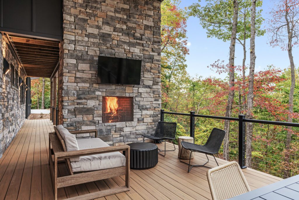 Outdoor deck seating at Wander Cedar Mountain with sunlight streaming in