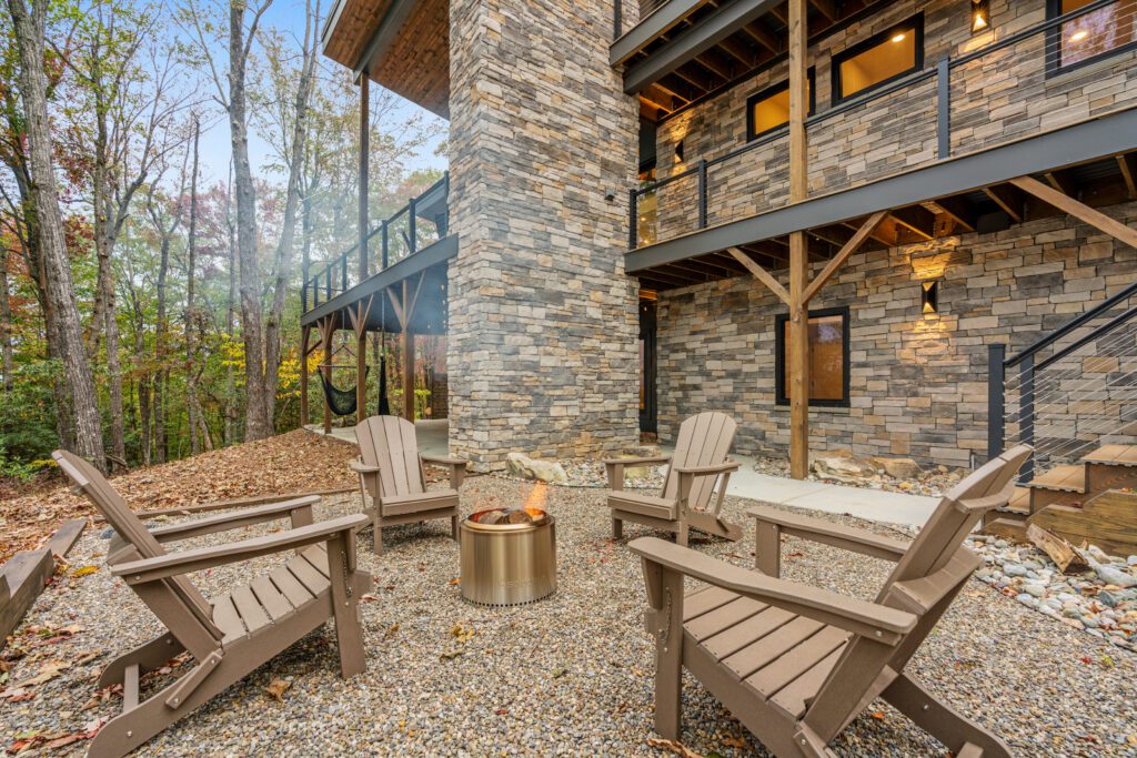 Cozy outdoor firepit at Wander Cedar Mountain with seating and mountain backdrop