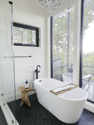 Luxurious primary bathroom suite at Wander Cedar Mountain with spa-like amenities